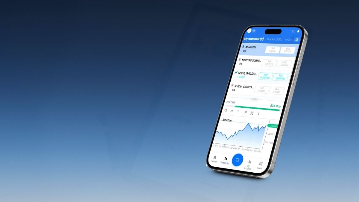 Teléfono mostrando aplicación de trading con acciones y gráfica